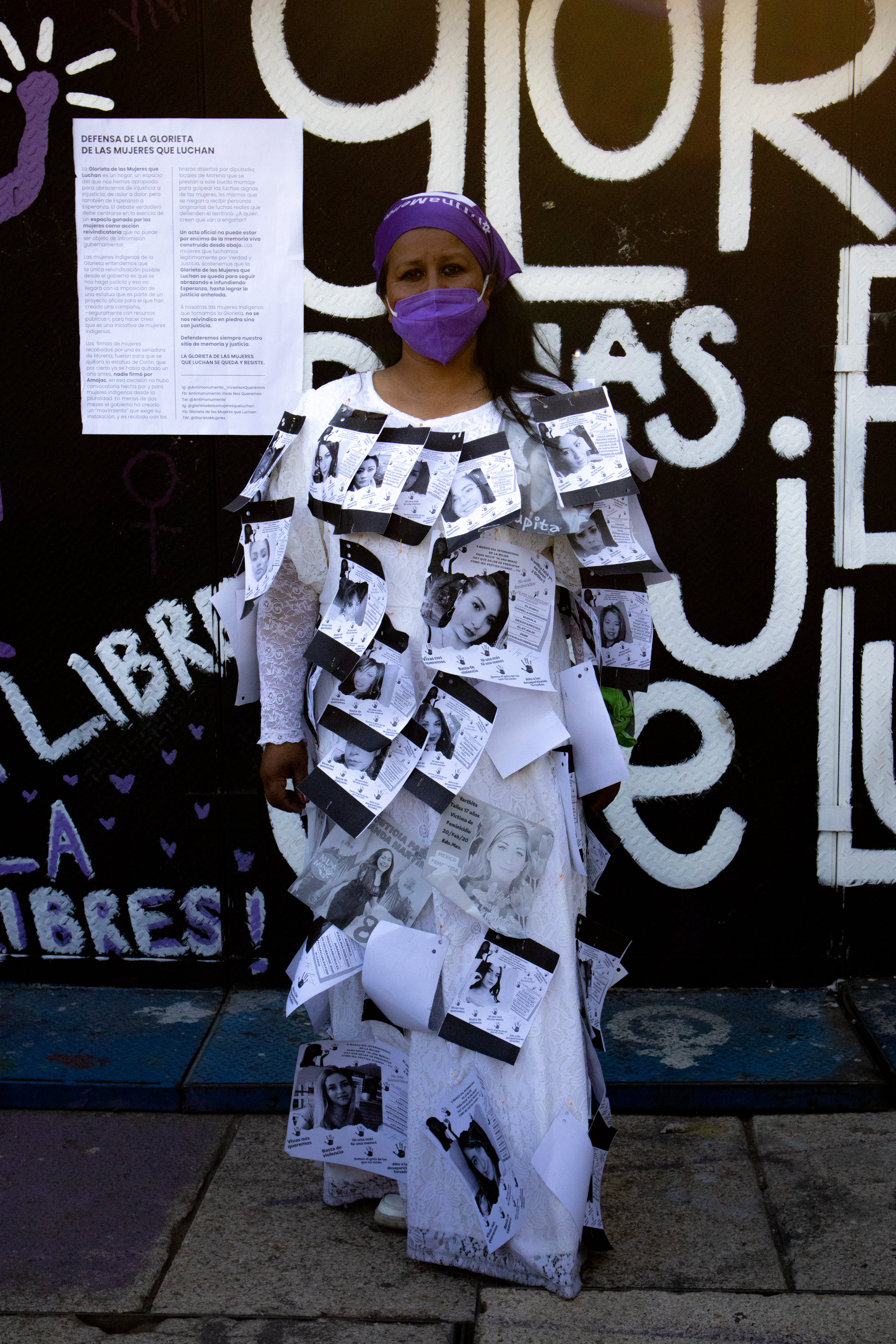 woman with posters glued to her dress