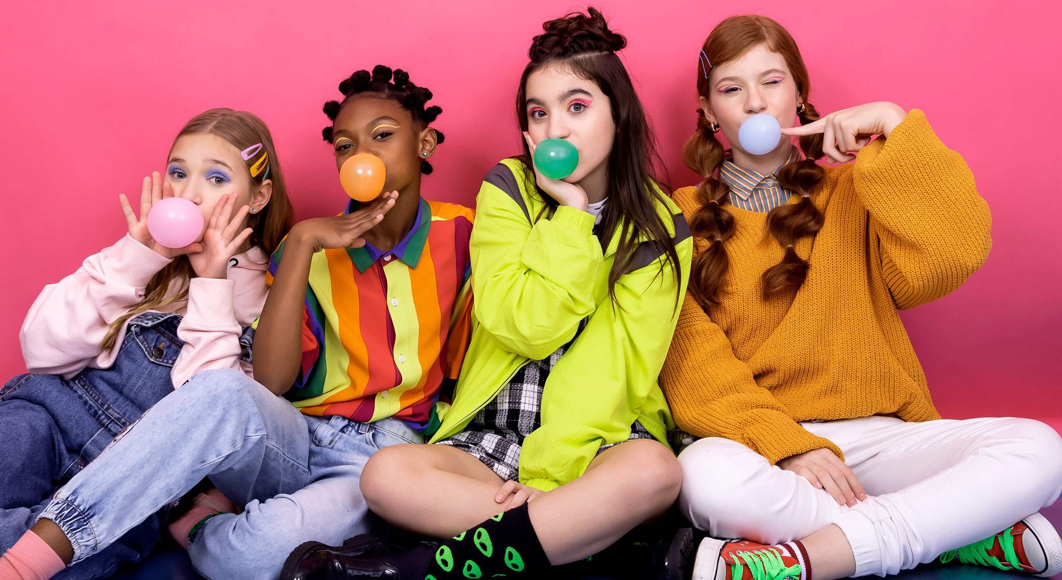 Teen girls sitting and chewing gum